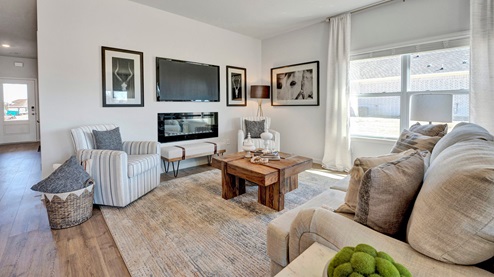 Living room opens up at the end of entry hall