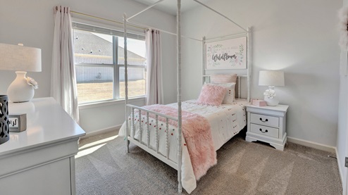 Third bedroom with carpet flooring and neutral walls