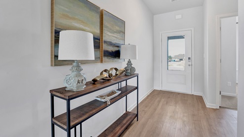 Front door entryway with natural light from front door glass insert