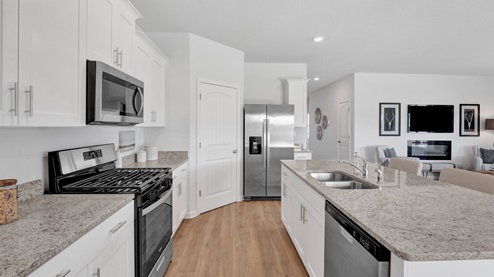 Spacious corner walk in pantry with ventilated shelving