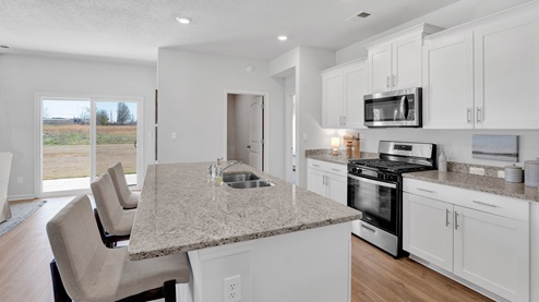 Spacious kitchen island with optimal space for bar seating
