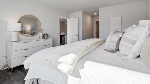 Spacious primary bedroom with vinyl flooring