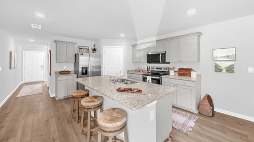 Kitchen area with a spacious kitchen island perfect for entertaining