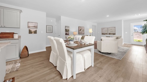 Dining area open concept view with close access to the primary bedroom