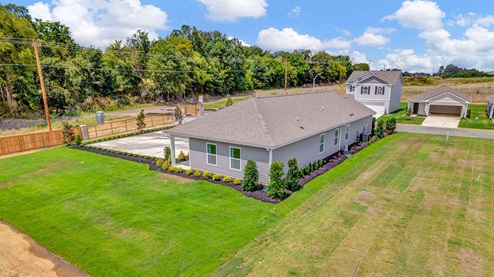 Drone view of the larges backyard of the Harper Model Home in Chickasaw Trails