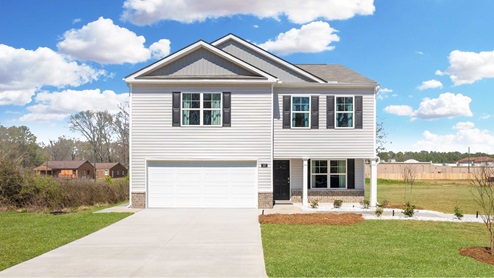 Two story home with two car garage and siding