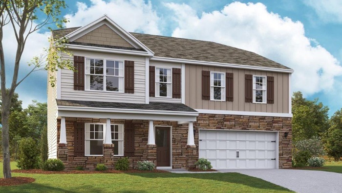 Two story home with two car garage and stone