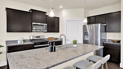 Kitchen with island and granite countertop