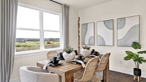 Dining area off kitchen with double window