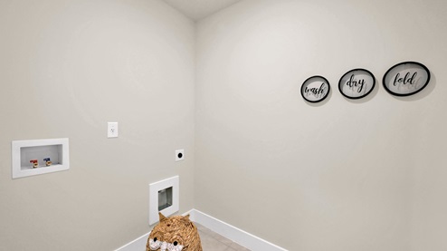Laundry room with shelving