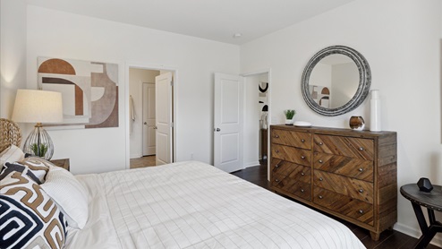 primary bedroom with view of dresser