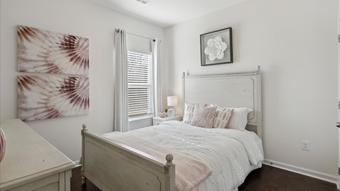 bedroom with bed and wall art