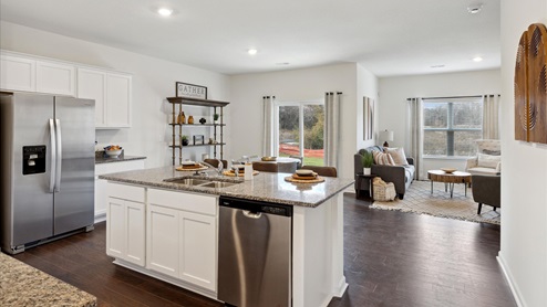 Modern kitchen with white cabinets and kitchen table