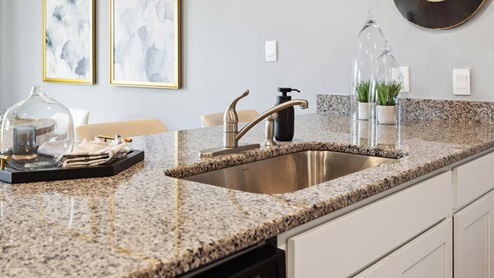 kitchen with granite countertops and white walls