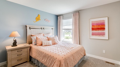 Secondary bedroom with standard closet.