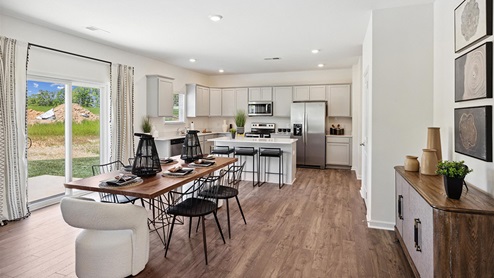 Interior breakfast area with glass sliding doors open to kitchen