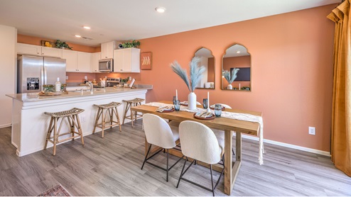 The Tribute Trails 1334 model Dining Room adjacent to the kitchen and Great Room.