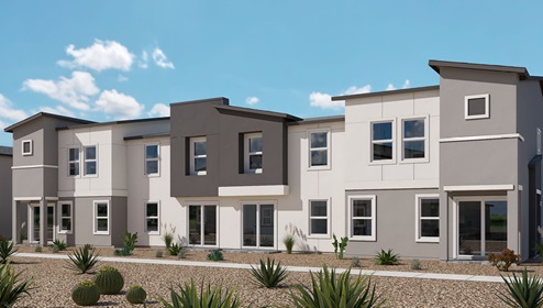 Our 1334 model home in the Kalea Trails community with grey and white exterior paint schemes, common area landscaping, and paved walkways.