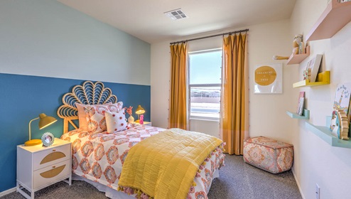 Bedroom Two in our Spectrum Trails 1334 model with carpet flooring and one window.