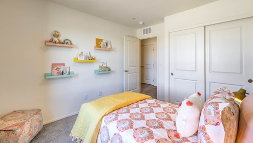 Bedroom Two in our Spectrum Trails 1334 model with carpet flooring and one window.