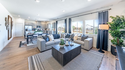 Open concept living space with large windows
