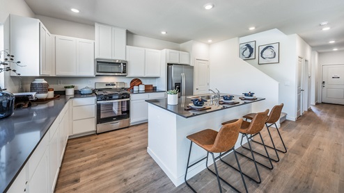 Modern kitchen with island and shaker-style cabinets