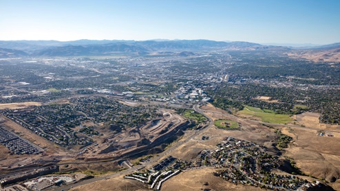 Aerial of Wolfridge community with mountains in the background