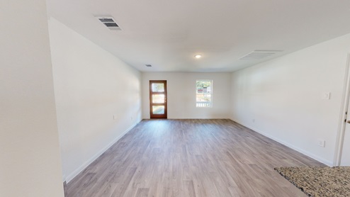 open concept living room with vinyl flooring