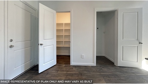 bedroom with closet and built in shelves
