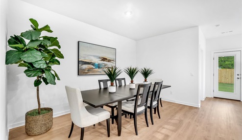 Dinning room table featuring a large wood table.
