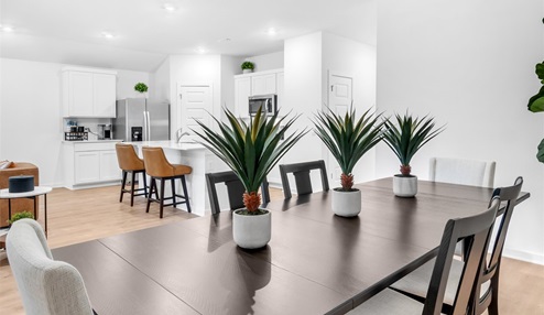 Open concept living space featuring a spacious living room area next to the dinning room.