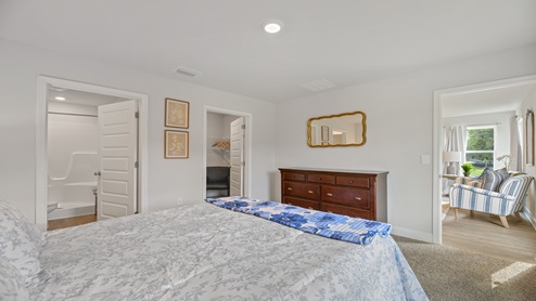 View of primary bedroom from the queen bed