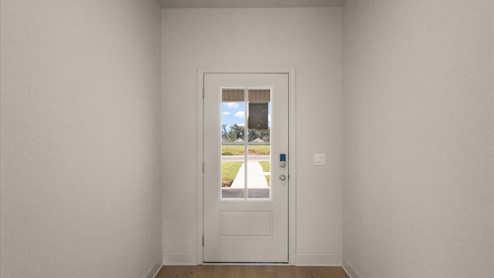 Front entryway and foyer with hardwood flooring