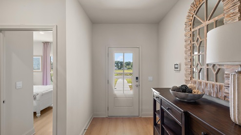 Front entryway and foyer with hardwood flooring