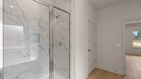 Walk in shower with built in shelf