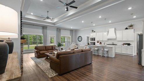 Interior living area with large windows open to kitchen