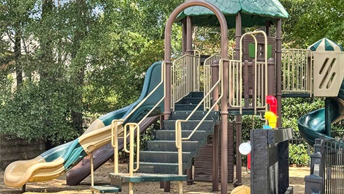 Cornerstone community tot lot with slide.