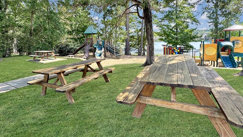 Cornerstone community play area with picnic tables.