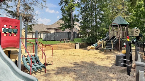 Cornerstone community play area with climbing area and slide.