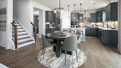 Breakfast area beside kitchen living room, and sliding glass back door