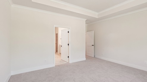 Carpeted bedroom with large window