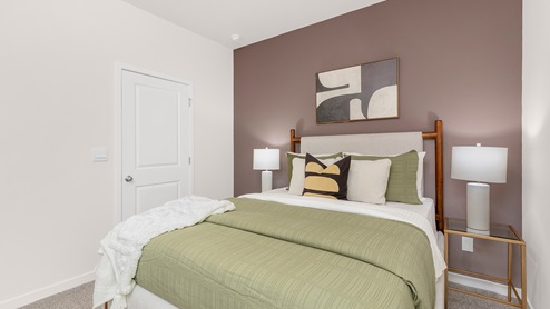 Carpeted bedroom with small windows