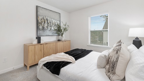 Carpeted bedroom with window