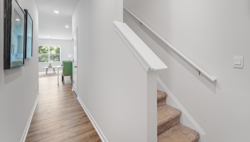 Entrance into Maywood with hallway and stairs.