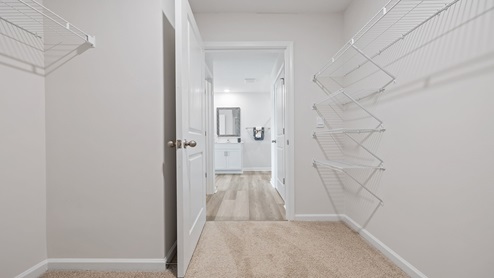 Closet with hanging storage racks.
