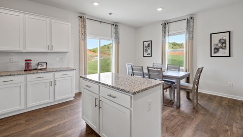 Kitchen with island and cabinets.
