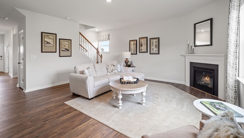 Living area with fireplace and windows.