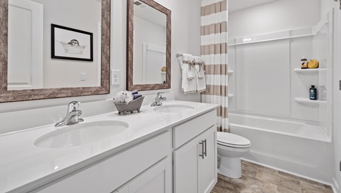 Bathroom with double vanity sinks.
