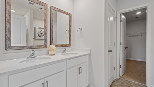 Primary bathroom with double vanity sinks.