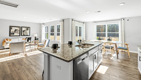 Kitchen and island with granite counter tops.